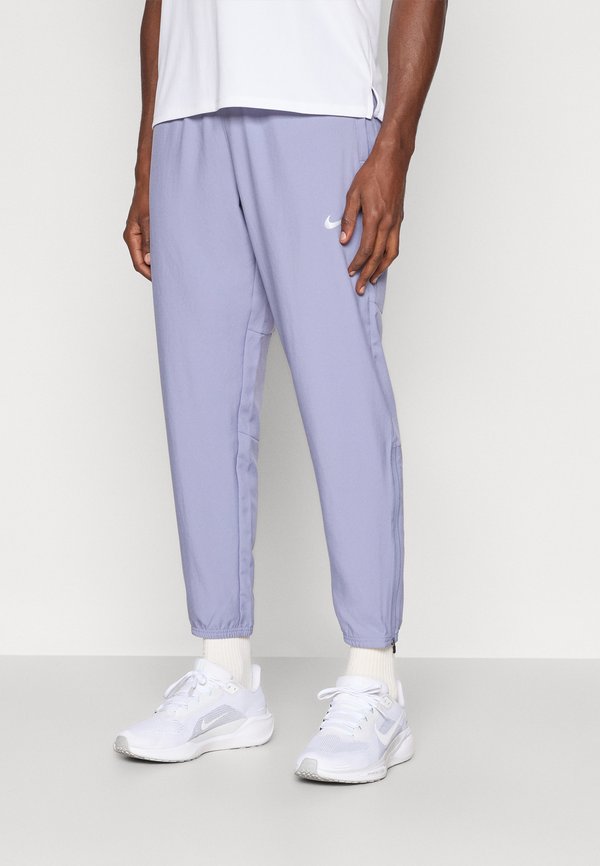 Nike Performance CHALLENGER PANT - Tracksuit bottoms - iron purple