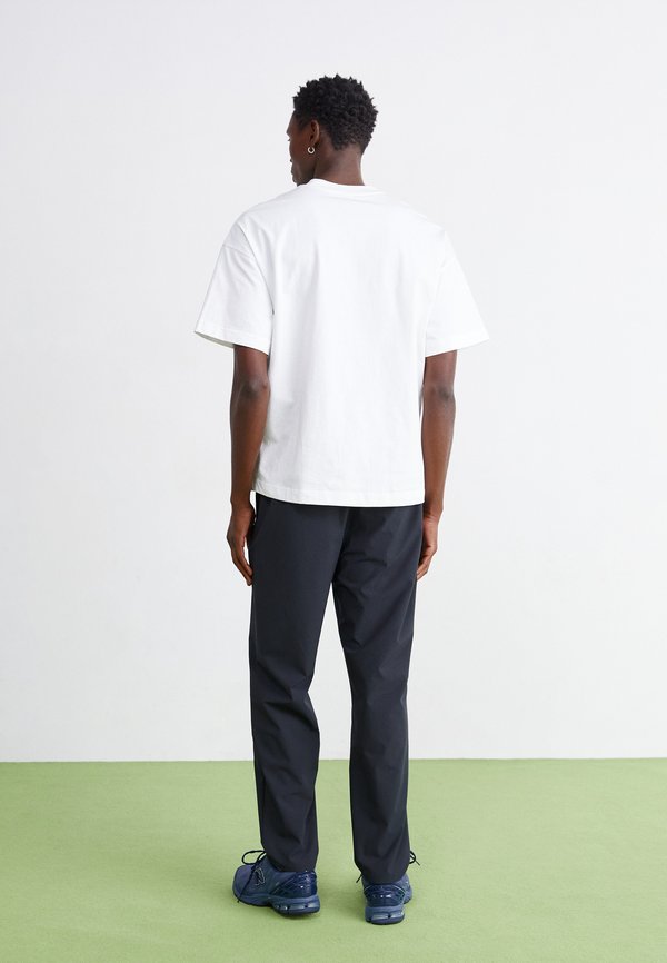 New Balance ATHLETICS RIPSTOP STANDARD TAPERED PANT 30"