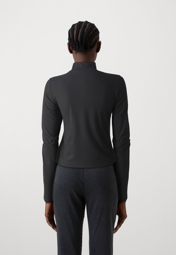 Noisy May NMDESTINY TURTLENECK