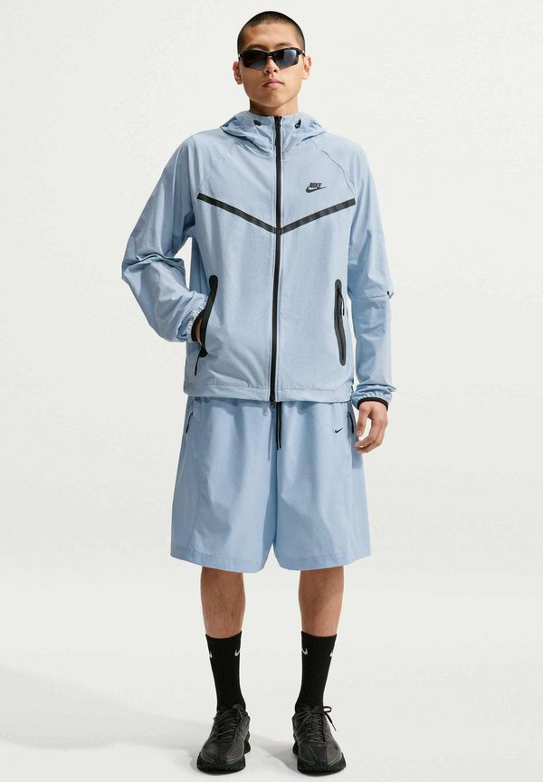 Nike Sportswear M NK DF TCH WVN WR FZ JKT - Summer jacket - light armoury blue light armoury blue black