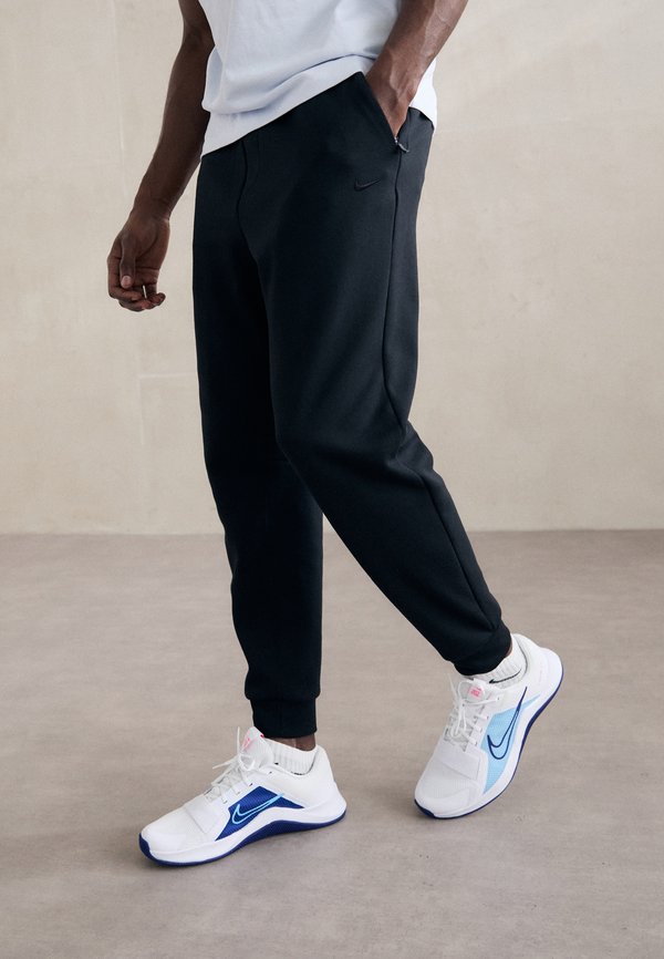 Nike Performance PRIMARY JOGGER PANT - Tracksuit bottoms - black