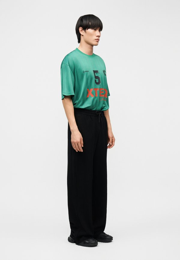 Han Kjøbenhavn LOGO TRAINING TROUSERS