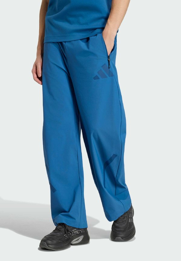 adidas Sportswear ADIDAS Z.N.E. WOVEN - Tracksuit bottoms - dusky petrol