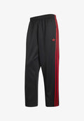 adidas Originals LOOSE  - Tracksuit bottoms - black/vivid red