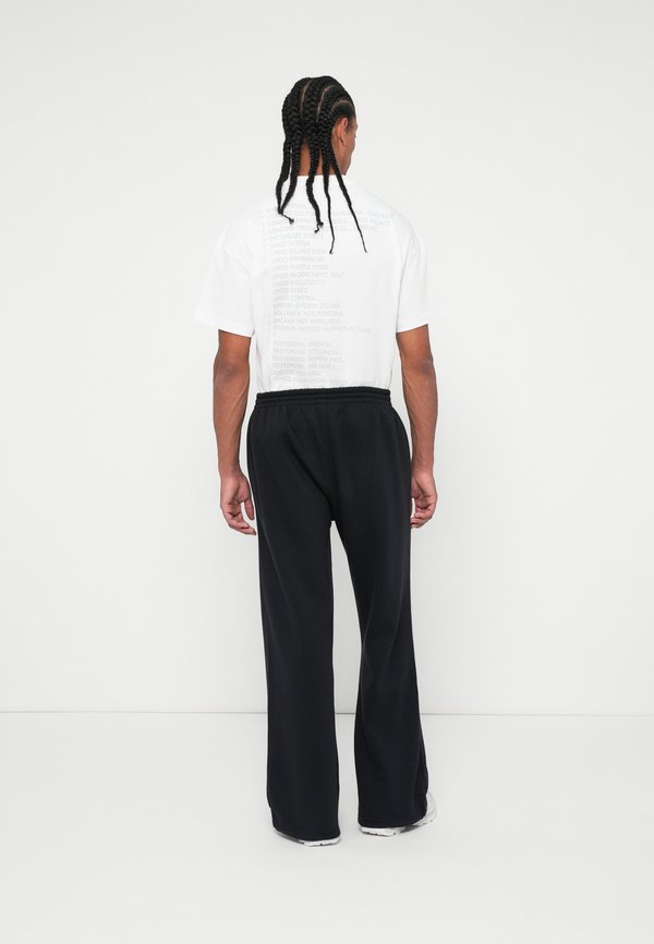 The Tracksuit Club JOGGING PANTS GLOBE UNISEX