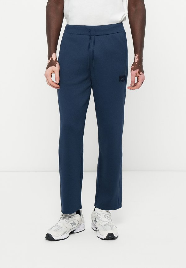 New Balance POST SEASON TRACK PANT - Tracksuit bottoms - blue