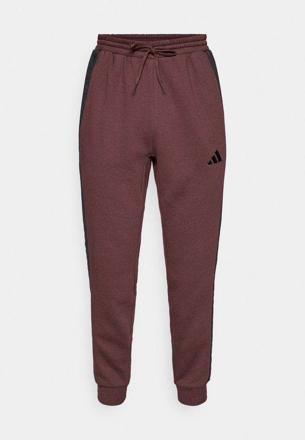 adidas Sportswear REGULAR FIT - Tracksuit bottoms - shadow brown/black