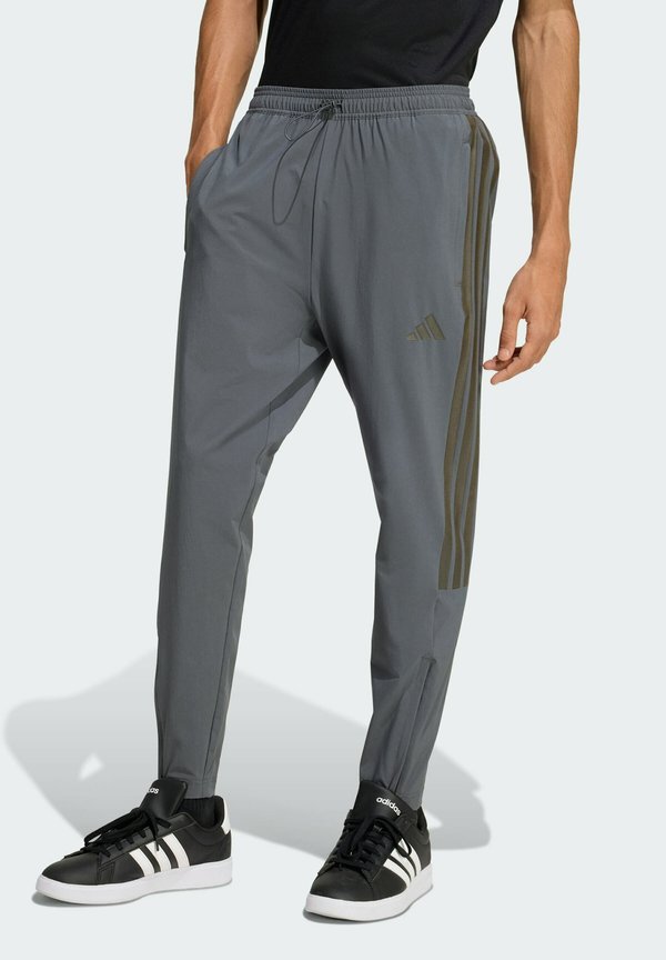 adidas Sportswear HOUSE OF TIRO - Tracksuit bottoms - grey six colored reflective