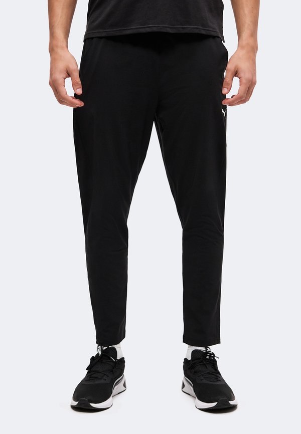 Puma PWRTRAIN - Tracksuit bottoms - black