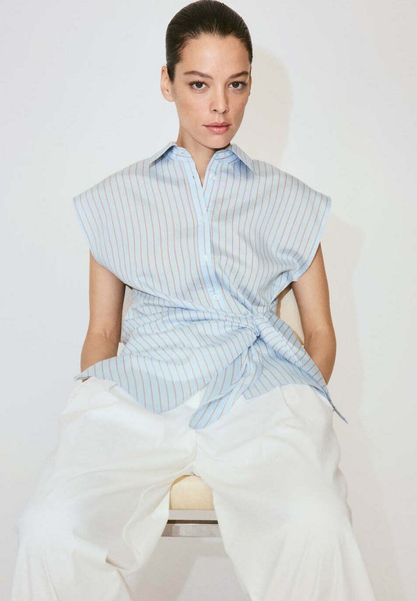 Mango ADULT - Button-down blouse - light blue