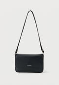 Calvin Klein RAISED SMALL FLAP MESSENGER - Cross body bag - black