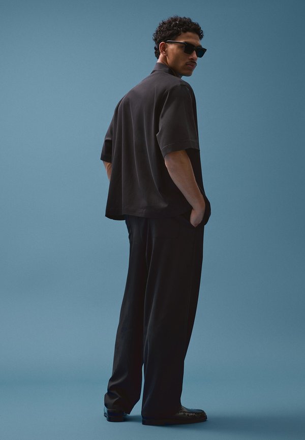 Bershka SUPER DARTED - Trousers - black