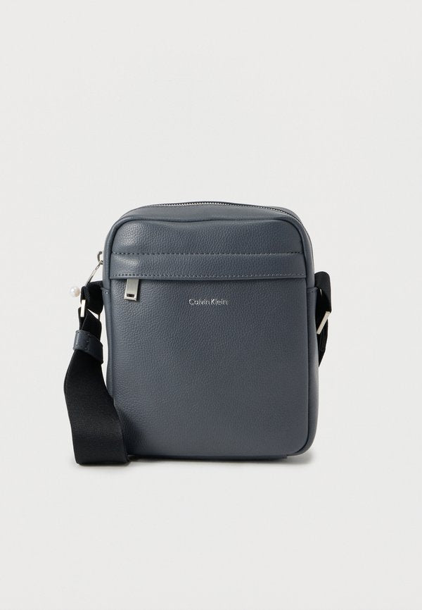 Calvin Klein RAISED REPORTER - Cross body bag - iron gate