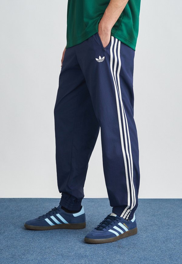 adidas Originals FIREBIRD - Tracksuit bottoms - night indigo