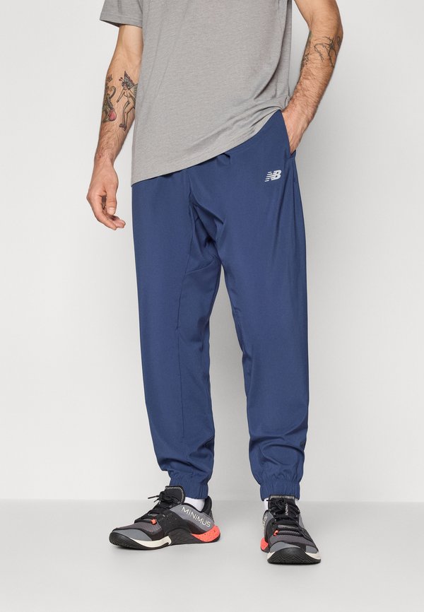 New Balance SPORT ESSENTIALS JOGGER - Tracksuit bottoms - navy