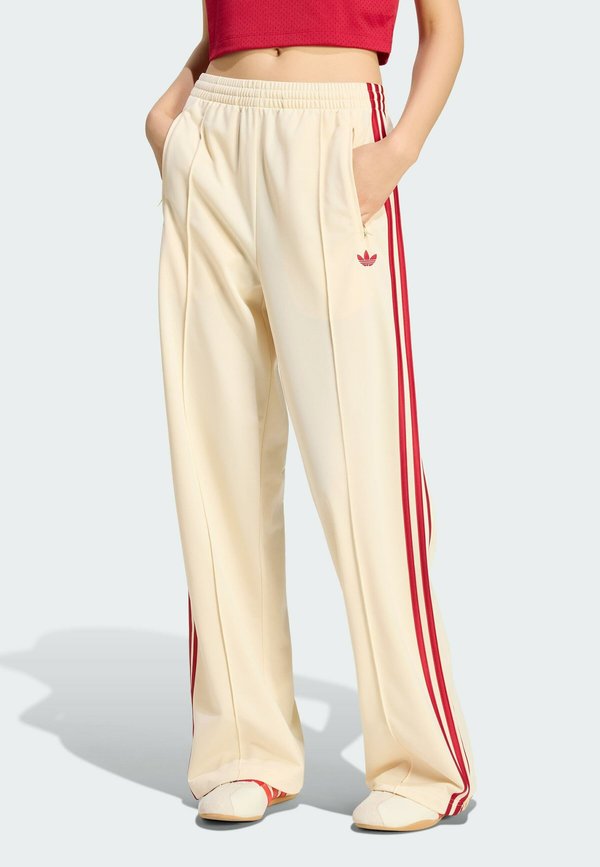 adidas Originals FIREBIRD LOOSE - Tracksuit bottoms - warm vanilla team victory red