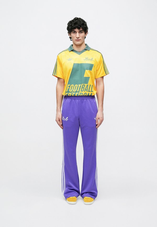 adidas Originals BOB MARLEY ORIGINALS PANTS - Tracksuit bottoms - purple rush