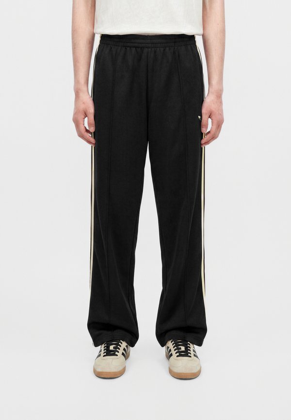 adidas Originals FIREBIRD PANTS UNISEX - Tracksuit bottoms - black/dual yellow