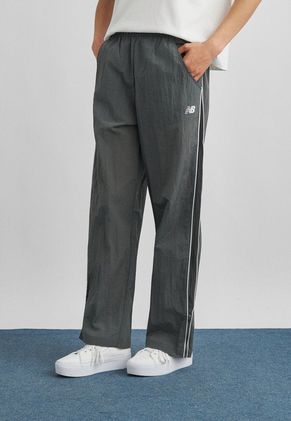 New Balance SPORT LEGACY - Tracksuit bottoms - castlerock
