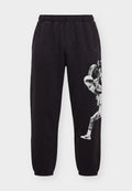Puma MEMORY LANE - Tracksuit bottoms - black