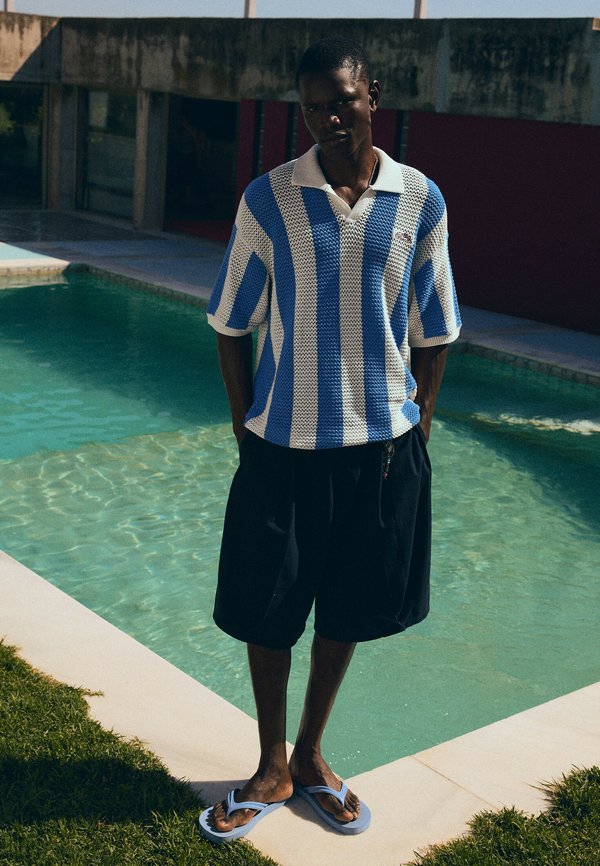 Bershka STRIPED SHORT SLEEVE MESH - POLO SHIRT - Polo shirt - light blue