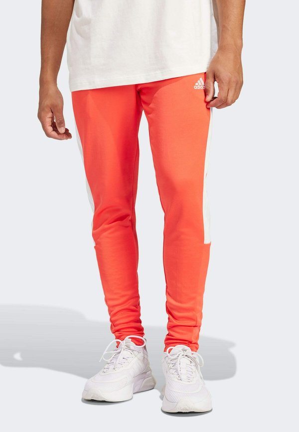 adidas Sportswear TIRO - Tracksuit bottoms - bright red   off white