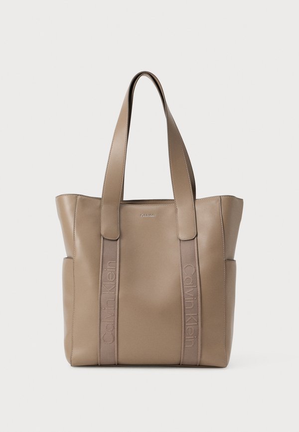 Calvin Klein SIGNATURE LOGO STRAP - Handbag - desert taupe