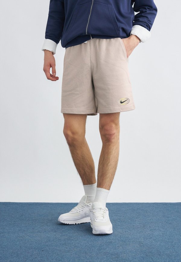 Nike Sportswear CLUB - Tracksuit bottoms - cream