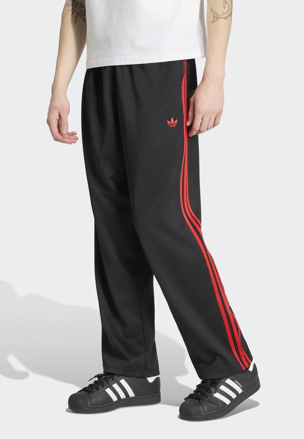 adidas Originals LOOSE  - Tracksuit bottoms - black/vivid red