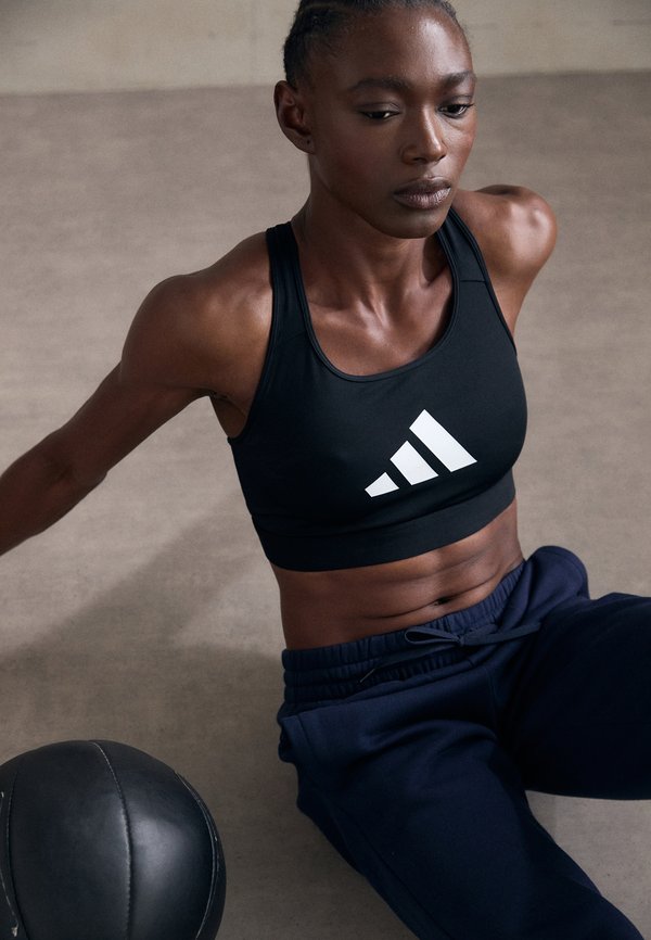 adidas Performance POWERREACT GRAPHIC - Light support sports bra - black