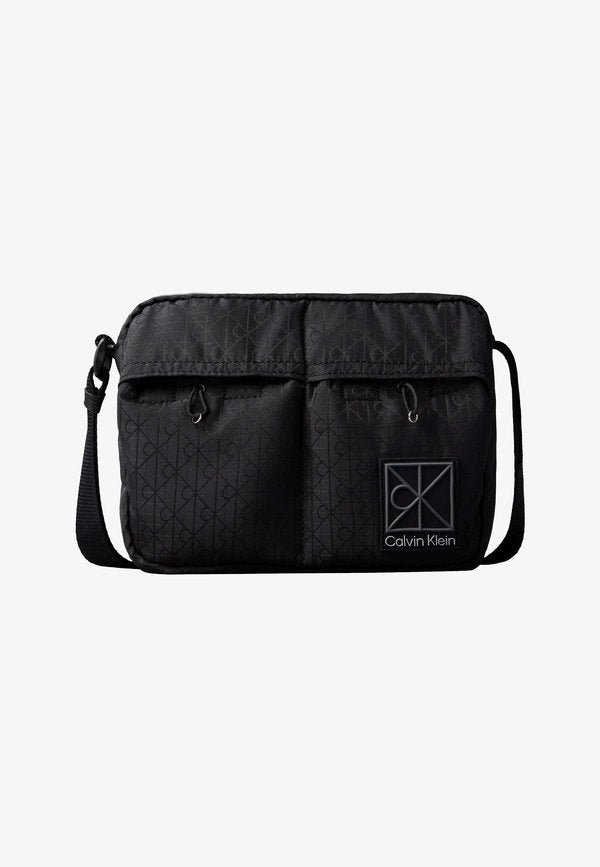 Calvin Klein EMBLEM - Cross body bag - black