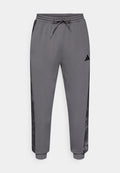 adidas Sportswear CAMO - Tracksuit bottoms - grey six/multicolor
