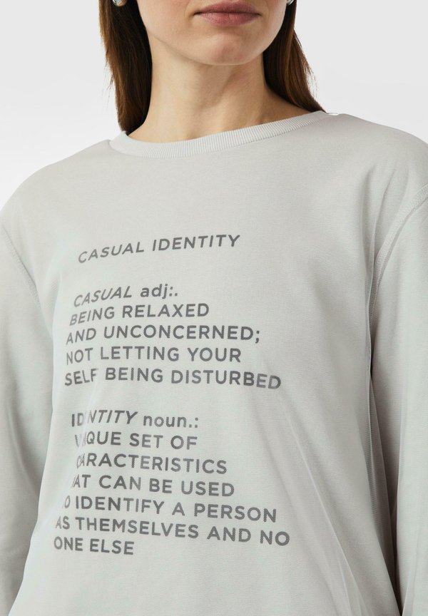comma casual identity MIT FRONT UND LAYER