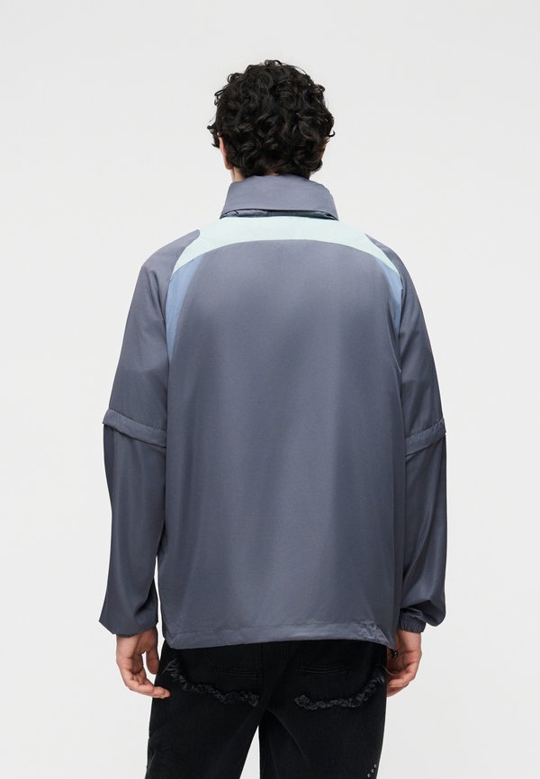 Umbro ZIP OFF SLEEVE WIND JACKET