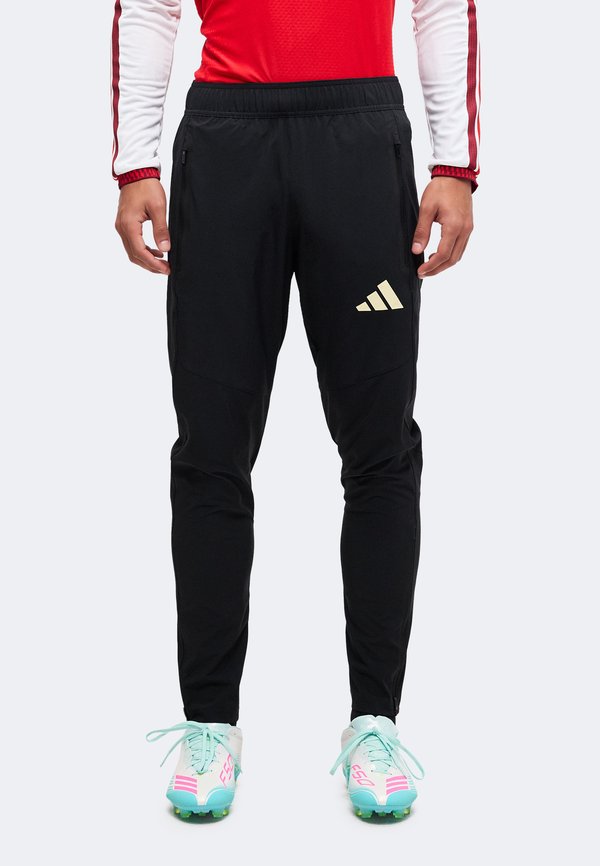 adidas Performance TIRO TRAVEL PANTS - Tracksuit bottoms - black/warm vanilla