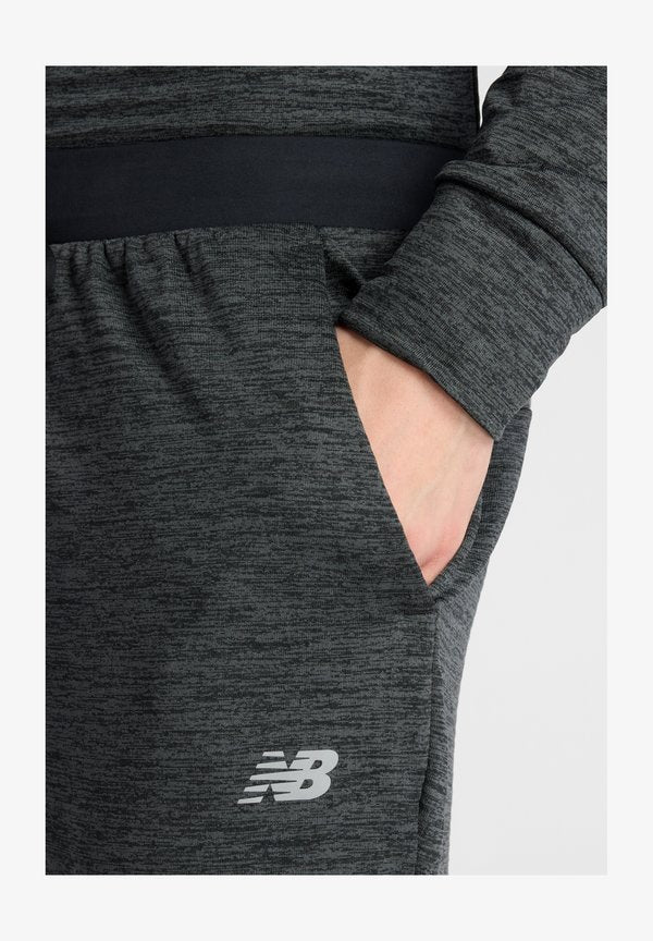 New Balance ATHLETICS HEAT GRID  - Tracksuit bottoms - black