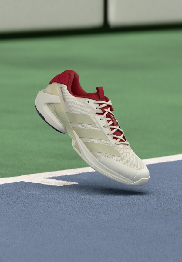 adidas Performance ADIZERO UBERSONIC 5 - Multicourt tennis shoes - chalk white/ice gold-coloured metallic/legend ink