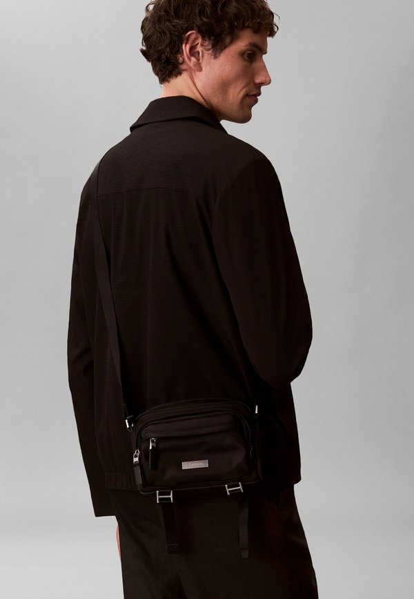 Calvin Klein SLEEK UTILITY - Camera bag - black