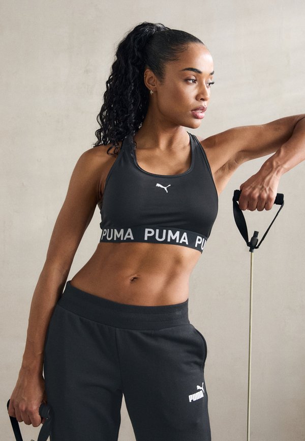 Puma 4KEEPS ELASTIC BRA - Medium support sports bra - black