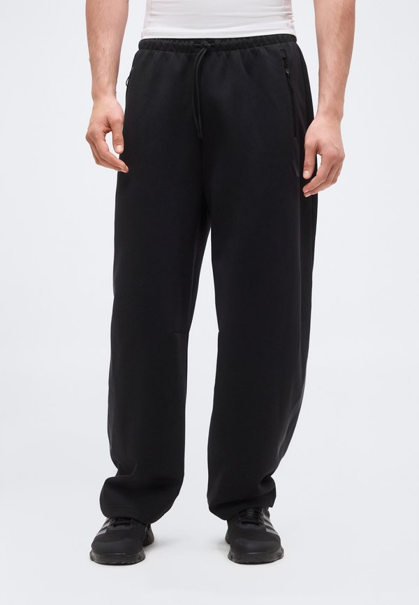 adidas Sportswear Z.N.E. OPEN HEM - Tracksuit bottoms - black