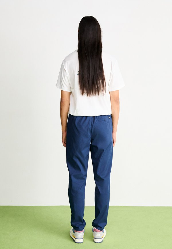 New Balance ATHLETICS STANDARD TAPERED PANT 30"