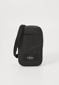 Calvin Klein TECH UTILITY RUBBER - Cross body bag - black