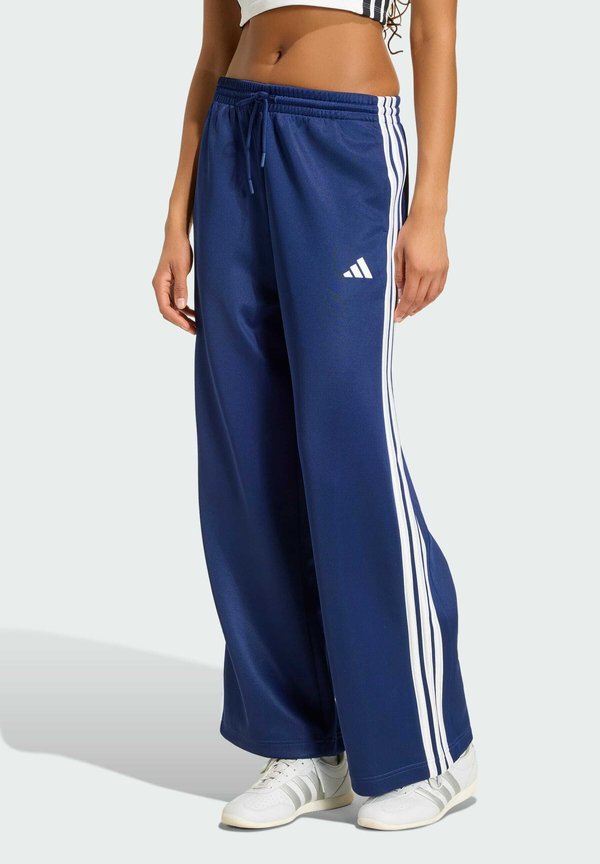 adidas Sportswear W STADIUM TP - Tracksuit bottoms - dark blue