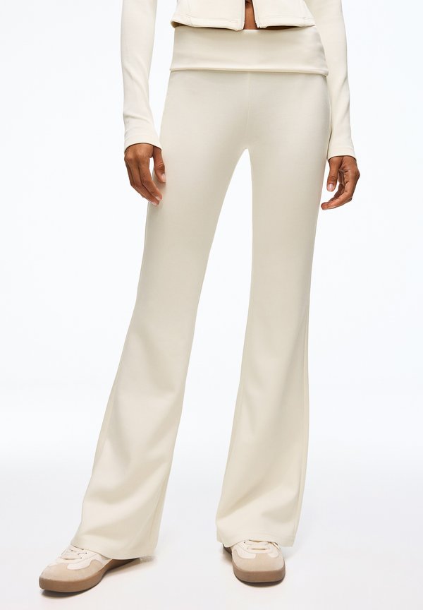 Bershka FLARED - TROUSERS - Trousers - beige
