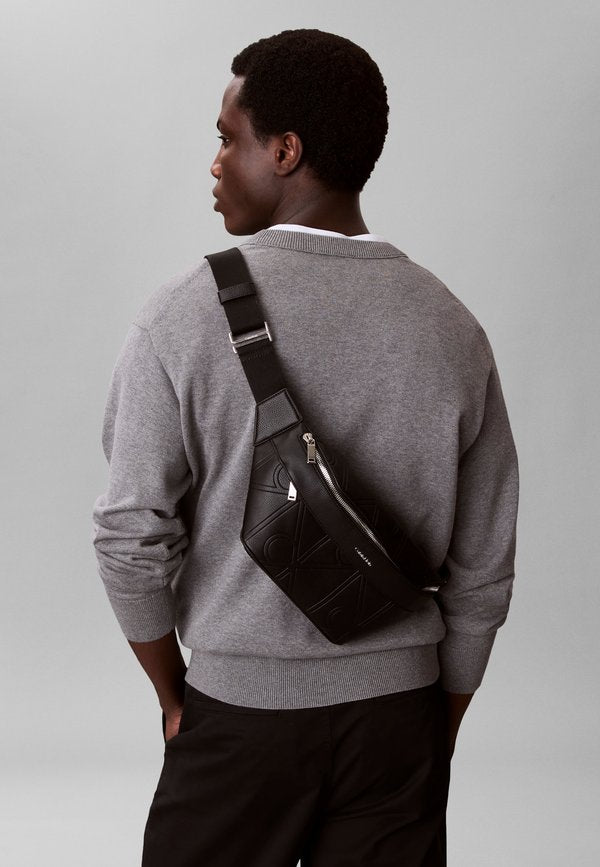 Calvin Klein EMBLEM EMBOSS WAISTBAG - Bum bag - black