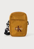 Calvin Klein BOLD LOGO SLIM REPORTER - Cross body bag - mustard yellow