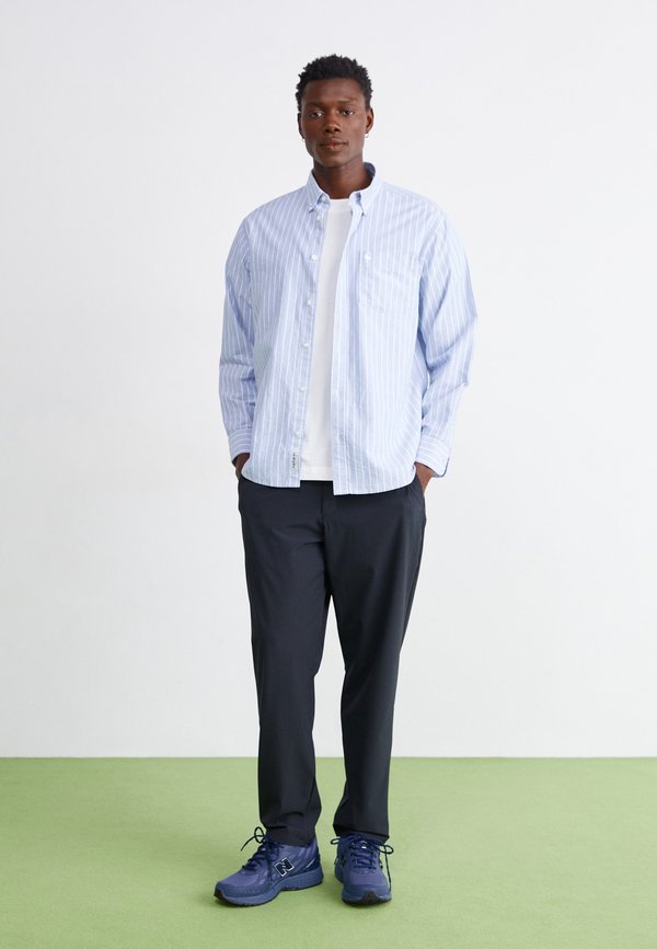 New Balance ATHLETICS RIPSTOP STANDARD TAPERED PANT 30"
