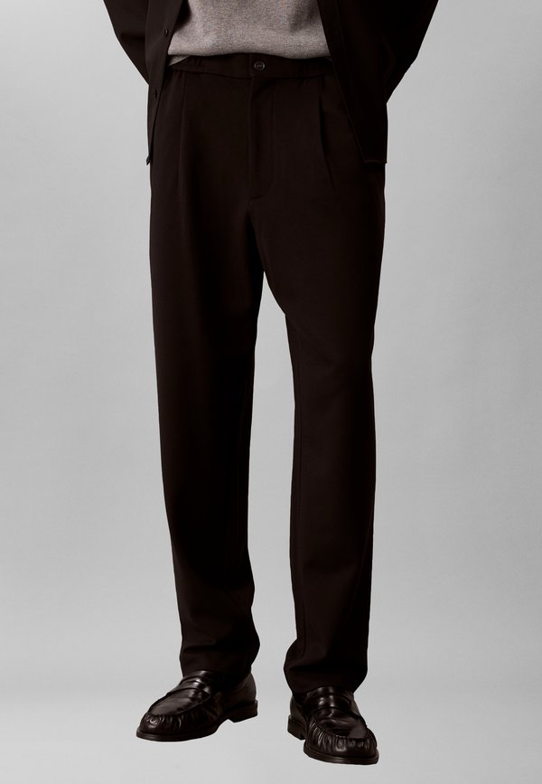 Calvin Klein TECH  - Trousers - black