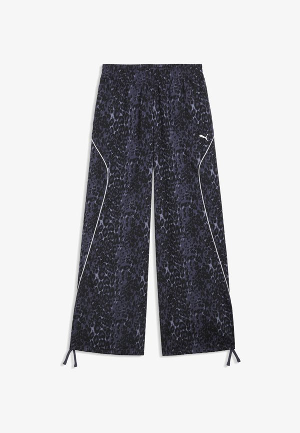 Puma PUMA SPORT ANIMAL RELAXED AOP WIDE LEG WOVEN PANTS - Tracksuit bottoms - inky depths