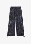 Puma PUMA SPORT ANIMAL RELAXED AOP WIDE LEG WOVEN PANTS - Tracksuit bottoms - inky depths